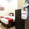 Отель OYO 723 Penginapan Nia Mandiri Syariah, фото 11