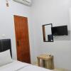 Отель OYO 936 Tremigo Guest House Syariah, фото 5