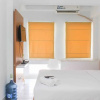 Отель Warm and Cozy Studio Patraland Urbano Apartment, фото 10