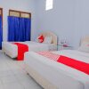 Отель OYO 421 Alianda Guest House Syariah, фото 15