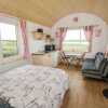 Отель The Beautiful Lazy Llama Shepherd Hut Farm Stay в Баллишанноне