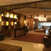 Отель Forbeswood Parklane Suites в Тагиге