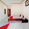 Отель Collection O 90461 Graha Atmadja Syariah Guest House, фото 21