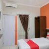 Отель OYO 589 Hotel Desa Puri Syariah, фото 18