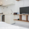 Отель Nice And Cozy Studio At Sky House Bsd Apartment, фото 9