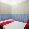 Отель OYO Life 93061 Kost Vicky Syariah, фото 10