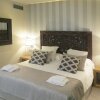 Отель Serennia Exclusive Rooms в Барселоне