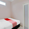 Отель OYO 90234 Dhoho Family Guest House, фото 12
