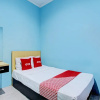 Отель OYO 93209 Guest House Cemara 3, фото 3