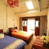 Отель Lijiang Xieyiju Hostel, фото 8