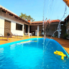 Отель Casa Familiar 4 quartos Piscina e Churrasqueira, фото 4