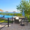 Отель Luxus Ferienwohnung in Pelekas Strand mit Pool adonis, фото 16