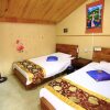 Отель Lijiang Xunniuge Guest House, фото 11