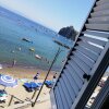 Отель Apartment with one bedroom in Ischia with wonderful sea view and terrace 20 m from the beach, фото 1