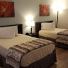 Отель Tricove Inn & Suites, фото 3