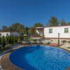 Отель Holiday house with private pool for 6-8 persons in the holiday park Jelovci, фото 1