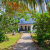 Отель Flame Tree Cottages в Нунгви