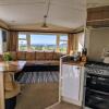 Отель Litua Caravan with stunning sea views, фото 4