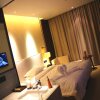Отель Thank Inn Plus Hotel Henan Zhengzhou  Economic and Technological Development Zone Tower, фото 1