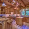 Отель Executive Plus 44 - Majestic log Chalet With hot tub Sauna Heated Pool and Close to Activities, фото 5