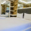 Отель Minimalist Comfy Studio Apartment at Educity Pakuwon, фото 17
