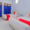 Отель OYO 421 Alianda Guest House Syariah, фото 21