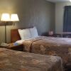 Отель Travelers Inn & Suites, фото 4