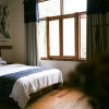 Отель ZhangJiaJie GuoKe Inn, фото 13