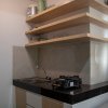 Отель Nice And Comfort 2Br At Serpong Garden Apartment, фото 1