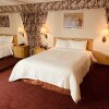 Отель Coliseum Inn & Suites - Garden City Long Island в Исте-Медоузе