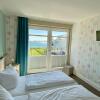 Отель Fehmarn-Ostseeferien Strandresidenz Vogelflug141 App 4Meerblick, фото 2