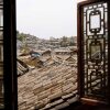 Отель Lijiang Xunniuge Guest House, фото 8