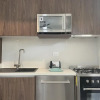 Отель Magnificent Stylish Apartment Charming Private Terrace Wonderful Community Pool Amenities, фото 3