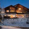 Отель Designferienhaus Luxus Bergchalet XXL Ski In-Out Snow Space Wagrain Flachau, фото 1
