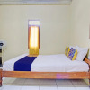 Отель SPOT ON 92930 Syifa Guest House Syariah, фото 3