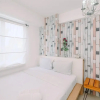 Отель Warm And Cozy 2Br At Low Floor Bassura City Apartment, фото 18
