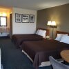 Отель Travelers Inn & Suites, фото 7