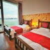 Отель Dali Shuanglang Macchiato Sea View Inn, фото 4