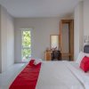 Отель RedDoorz Plus Syariah @ Raya Nginden 2, фото 5