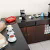 Отель LeGreen Suite Ratulangi, фото 18
