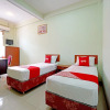 Отель OYO 90836 Bartu Guesthouse, фото 7