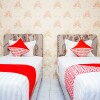 Отель OYO 433 Nelvi Guest House Syariah, фото 19