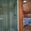 Отель Executive Plus 44 - Majestic log Chalet With hot tub Sauna Heated Pool and Close to Activities, фото 14