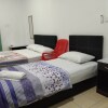 Отель OYO Home 90344 Dropby Cabin в Кампунг Китунтул