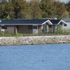 Отель Modern Chalet With Dishwasher on the Markermeer, фото 11