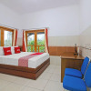 Отель OYO 92533 Harjuna Guest House, фото 9
