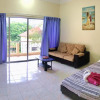 Отель OYO HOME 90700 Teluk Batik Holiday Apartment, фото 7