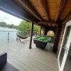 Отель Woodpecker Log Cabin with hot tub, pizza oven bbq entertainment area, lakeside with private fishing , фото 37