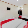 Отель Collection O 90461 Graha Atmadja Syariah Guest House, фото 22