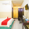 Отель RedDoorz Plus near Pelabuhan Bitung, фото 4